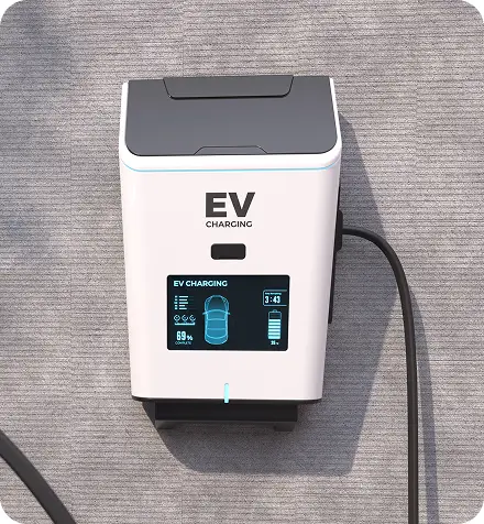 An electric vehicle charging station in the parking area at the Heart of Manteo Motor Lodge